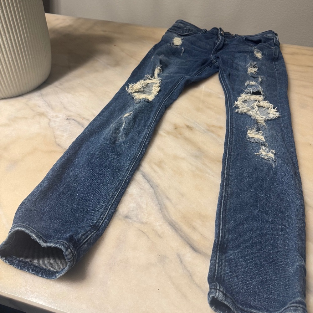 Men’s distressed Guess Jeans